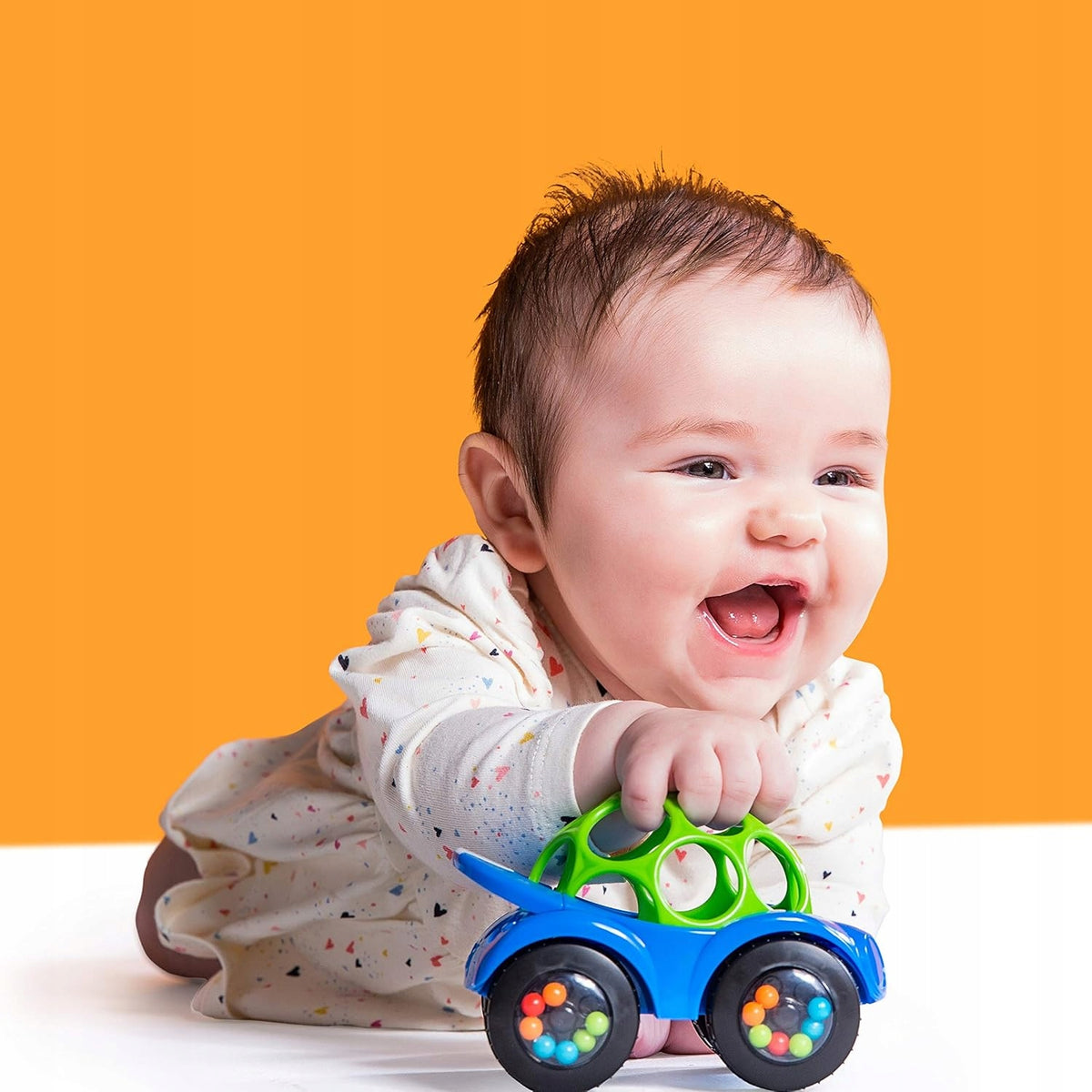 BRIGHT STARTS Oball Rattle & Roll voiture roulante avec hochet