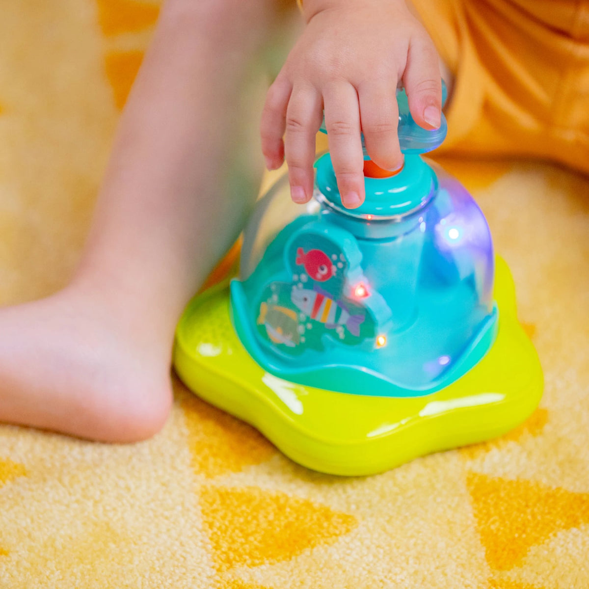 Bright Starts Press Glow Spinner musikalsk legetøj 6m+