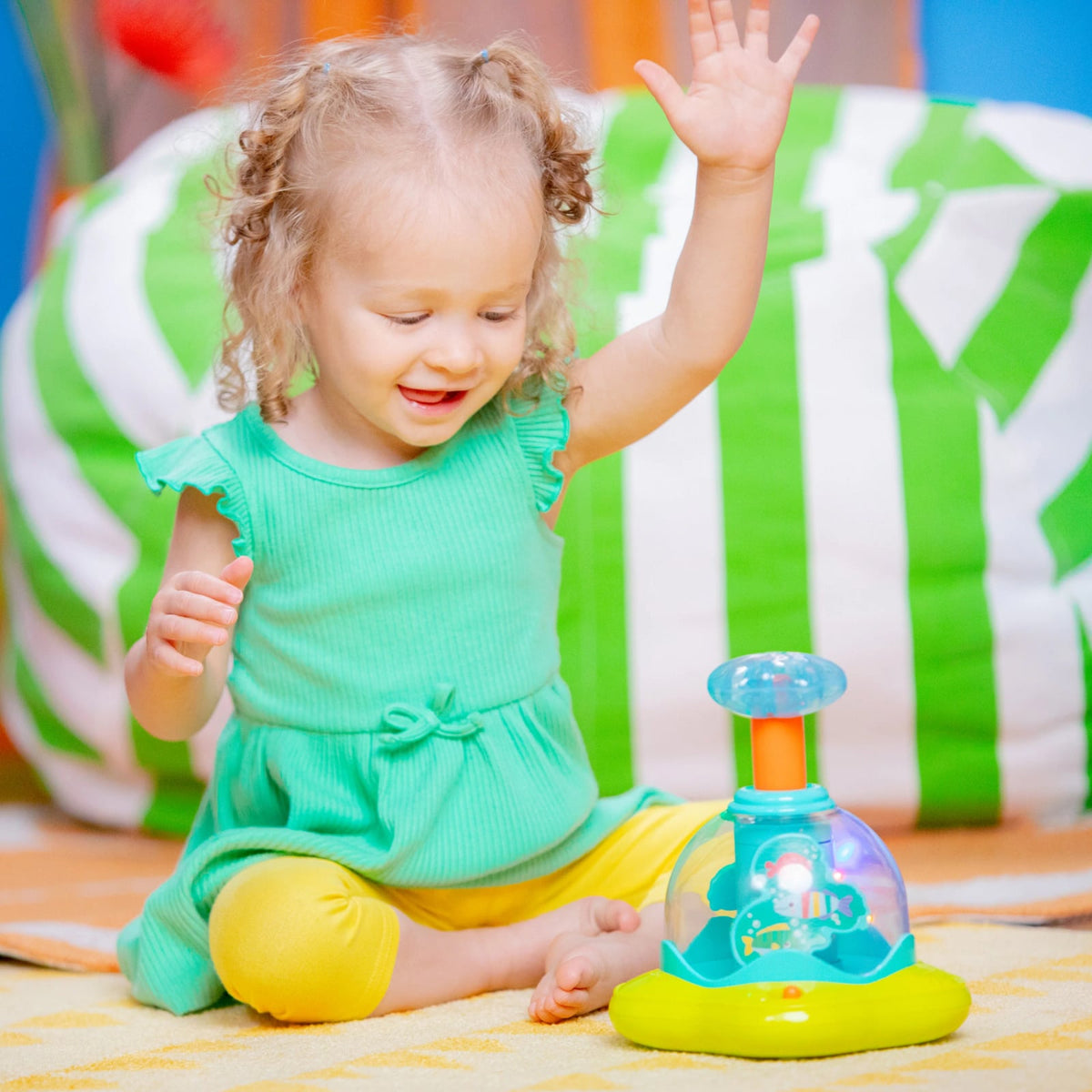 Bright Starts Press Glow Spinner musikalsk legetøj 6m+