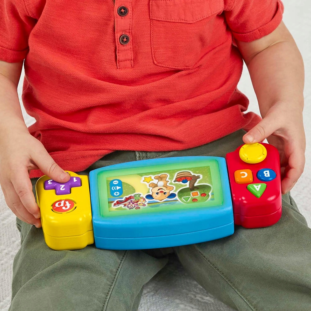FISHER-PRICE HNN39 kis játékos konzol német nyelvű